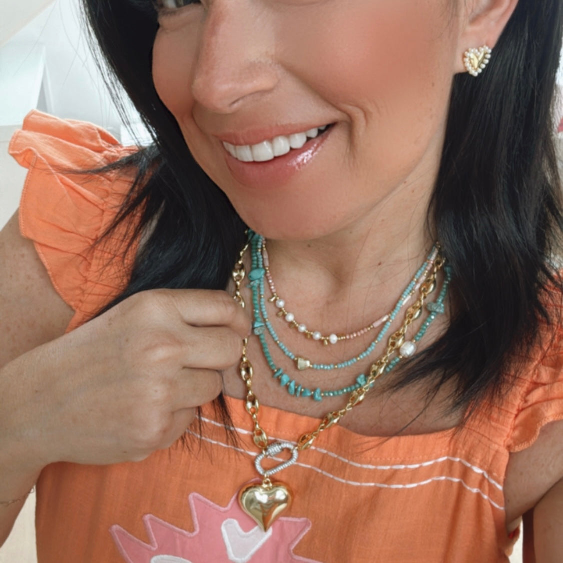 Dainty gold layered necklace with shiny heart pendant and glitter carabiner for wholesale jewelry for women's boutiques statement accessory waterproof trendy hypoallergenic tarnish free boutique wholesale jewelry