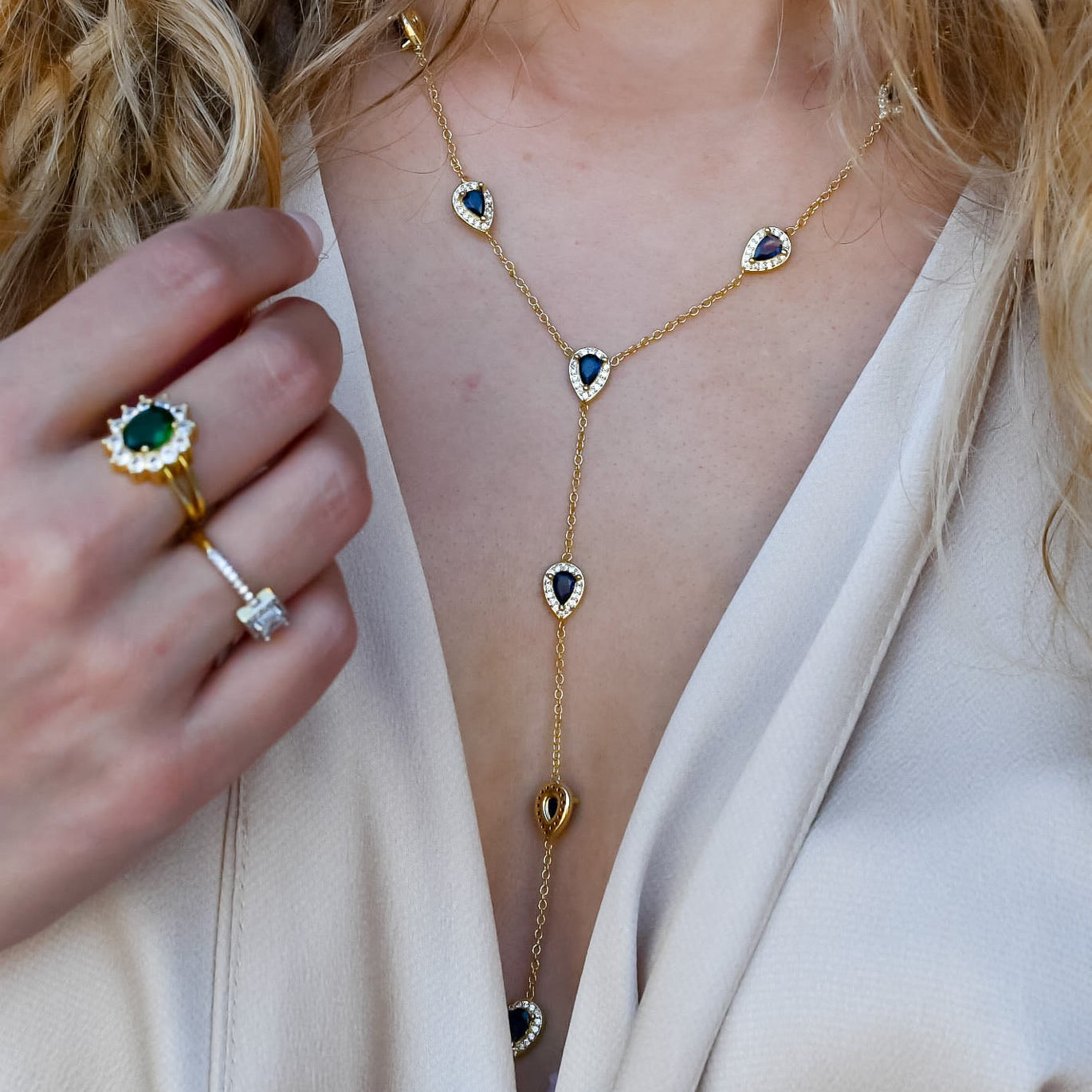 Dainty gold necklace with teardrop-shaped blue-toned crystal pendant, waterproof, hypoallergenic and tarnish-free, elegant and trendy accessory for women’s boutique jewelry