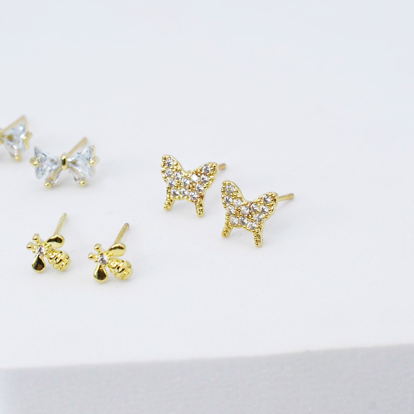 gold butterfly stud earrings set, crystal bow studs, mini bee earring trio, dainty gold jewelry pack, boutique style accessories, tarnish free, hypoallergenic, waterproof, wholesale earrings for boutique