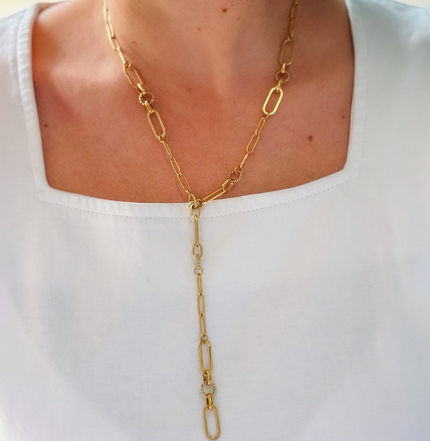 Dainty gold layered necklace featuring a delicate elongated paperclip chain with a Y-drop lariat design made of interlocking textured links, waterproof, hypoallergenic, tarnish free, statement accessories, wholesale jewelry for women boutiques