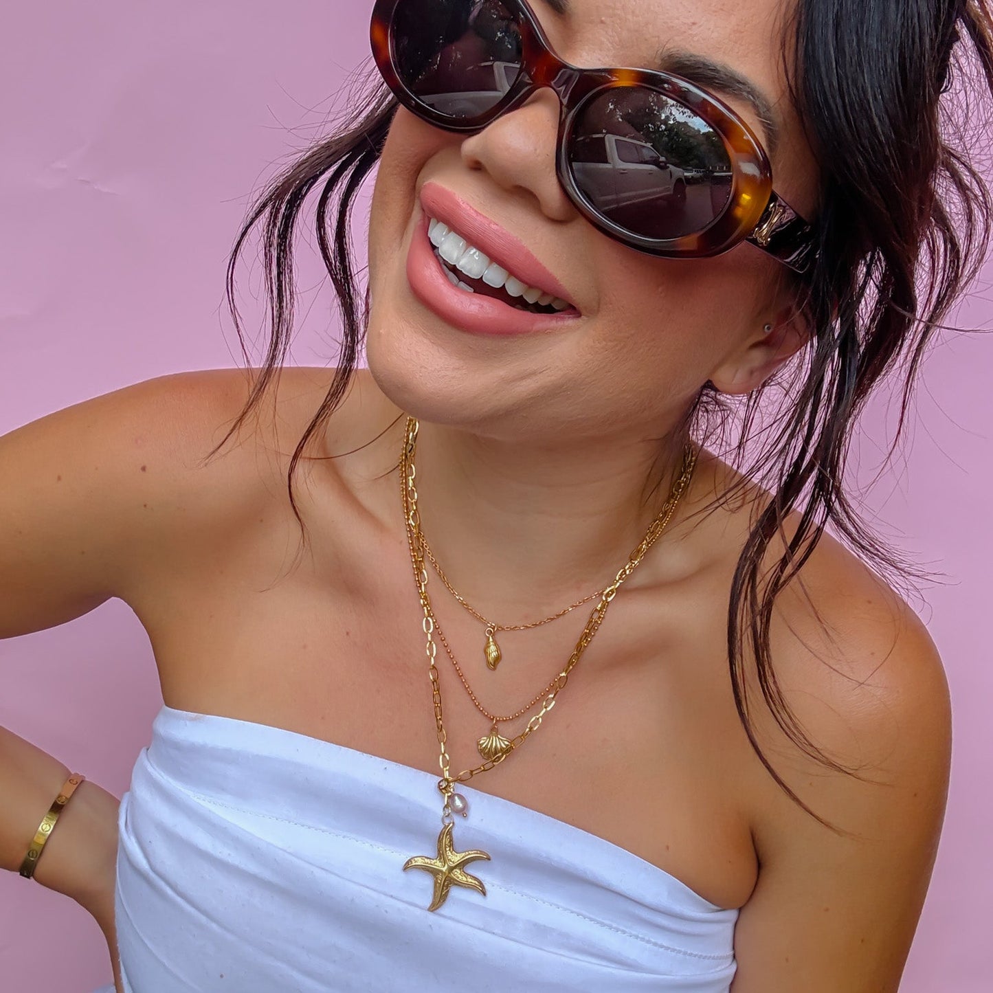 Gold layered necklace, starfish pendant necklace, seashell charms, pearl detail, beach-inspired jewelry, ocean theme accessory, trendy layered gold chain, boutique wholesale jewelry, waterproof, hypoallergenic, tarnish free